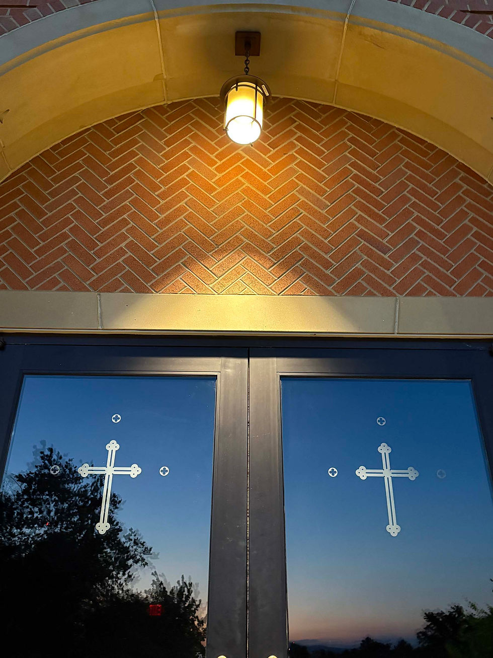 The front doors of Holy Trinity Catholic Parish